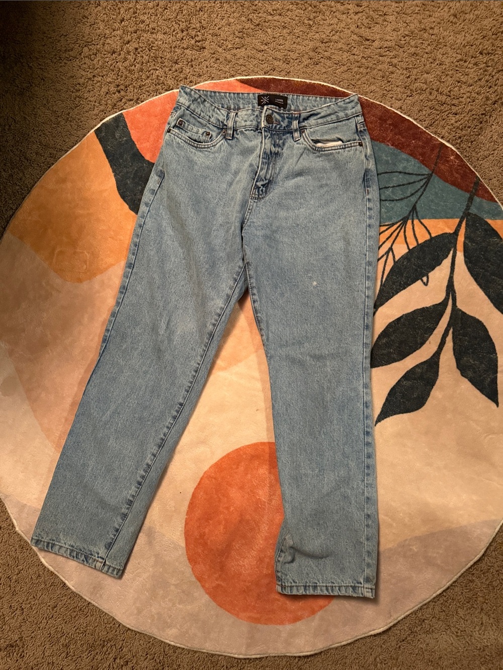 Light blue denim. Relaxed, baggy, worn in. 30x30